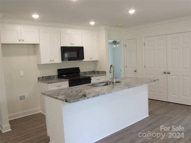 kitchen with a kitchen island with sink, sink, white cabinets, and black appliances