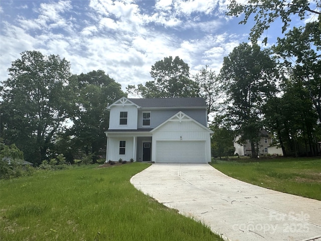 168 Wildwood Loop, Statesville, NC 28625 - traditional home with an attached garage, a front lawn, and concrete driveway
