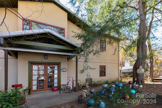 property entrance featuring french doors