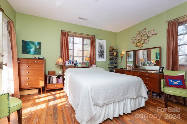 bedroom with wood-type flooring