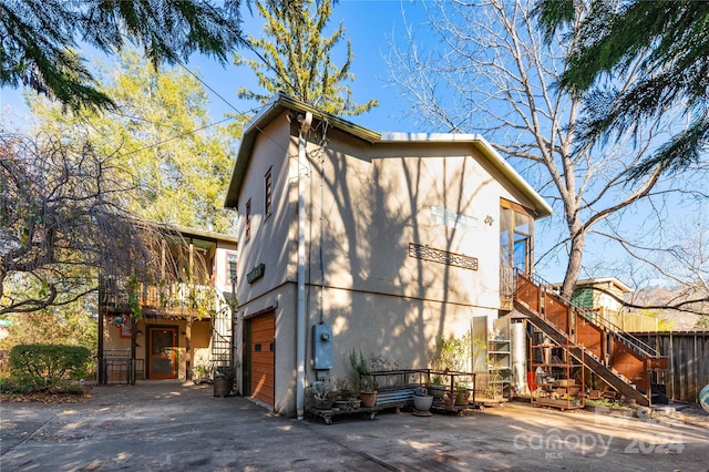 view of side of property featuring a garage