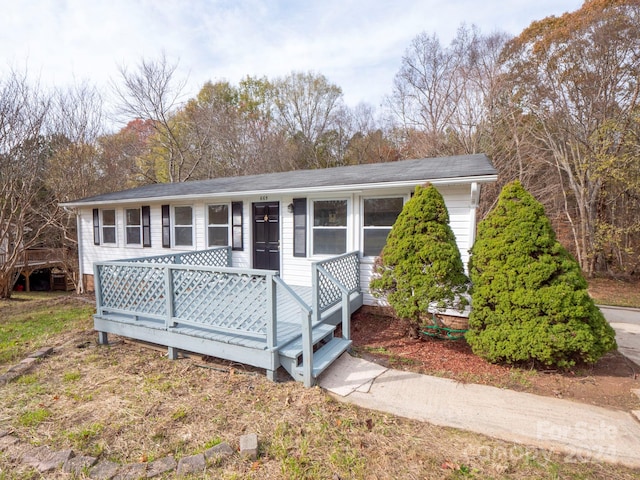 view of front of house with a wooden deck