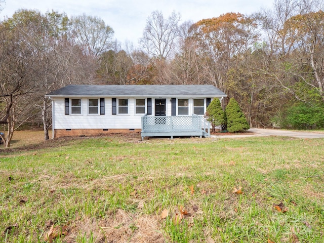 ranch-style house with a front lawn