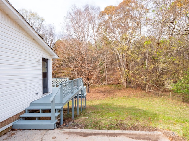 view of yard with a wooden deck