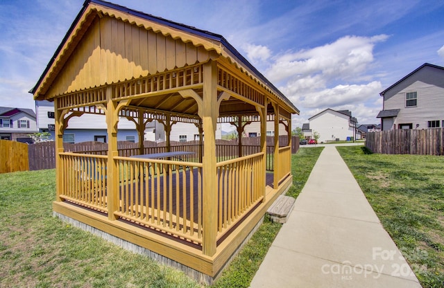 view of property's community with a gazebo and a lawn