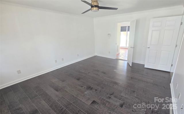 unfurnished room with dark wood finished floors, ceiling fan, crown molding, and baseboards