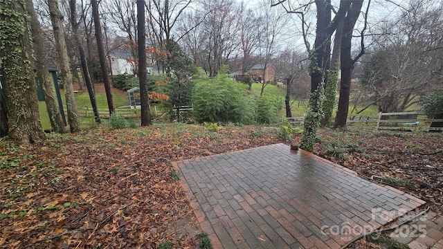 view of home's community with a patio and fence