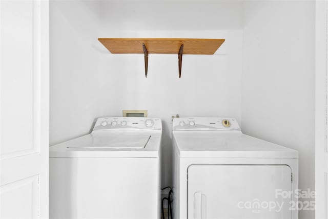 washroom with separate washer and dryer