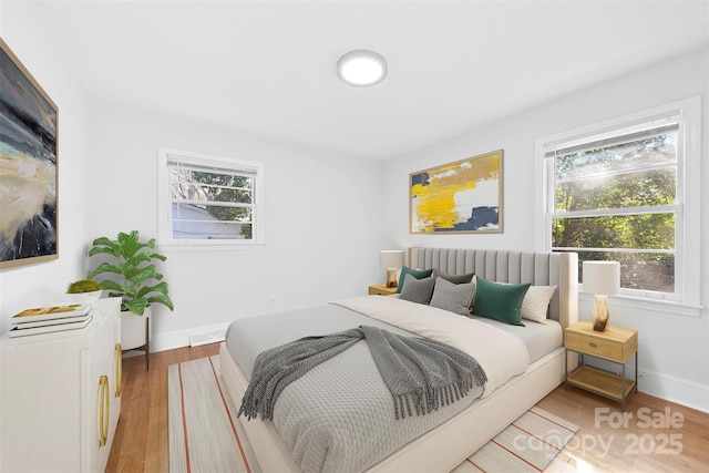 bedroom with light hardwood / wood-style flooring