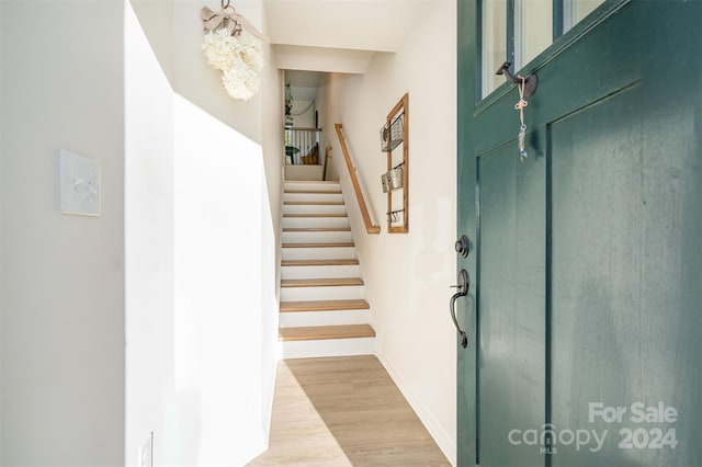 staircase with wood-type flooring