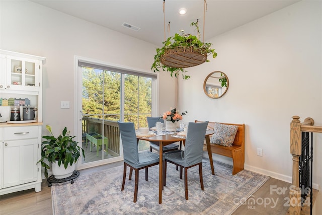 dining area featuring light wood-type flooring