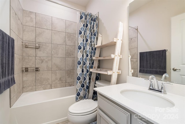 full bathroom with vanity, shower / tub combo, and toilet