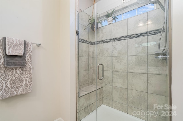 bathroom with an enclosed shower