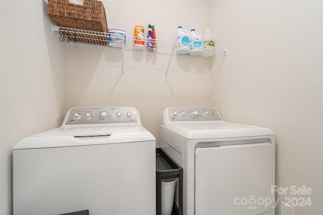 washroom featuring washer and clothes dryer