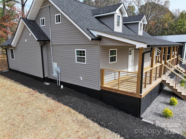 back of property featuring a porch