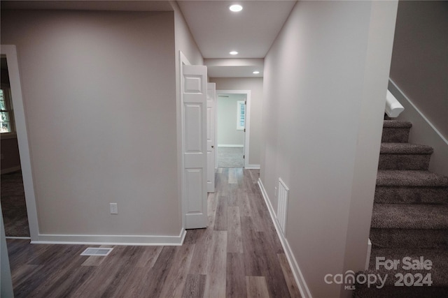 hallway featuring wood-type flooring