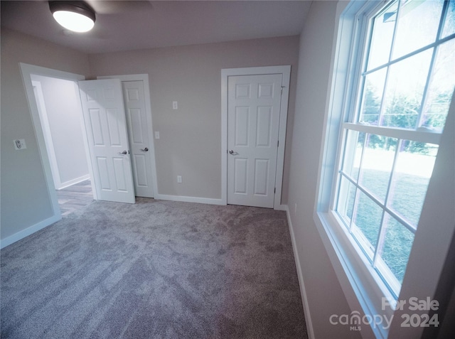 unfurnished bedroom featuring carpet