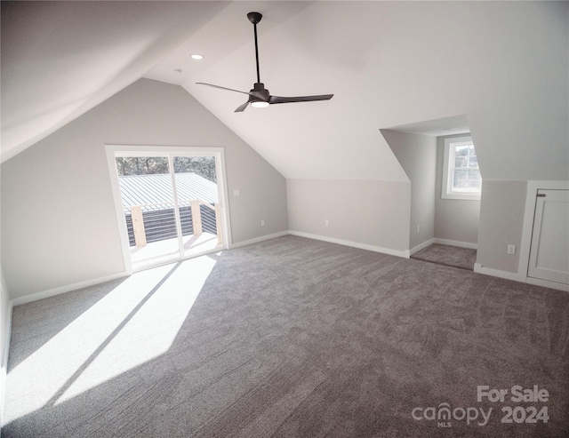 additional living space featuring carpet flooring, ceiling fan, and lofted ceiling