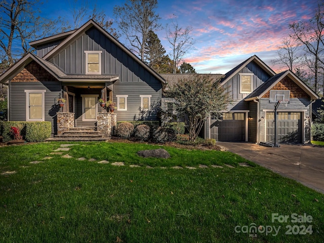 268 Firefly Cv, Lake Lure, NC 28746 - craftsman inspired home with board and batten siding, a lawn, driveway, and an attached garage
