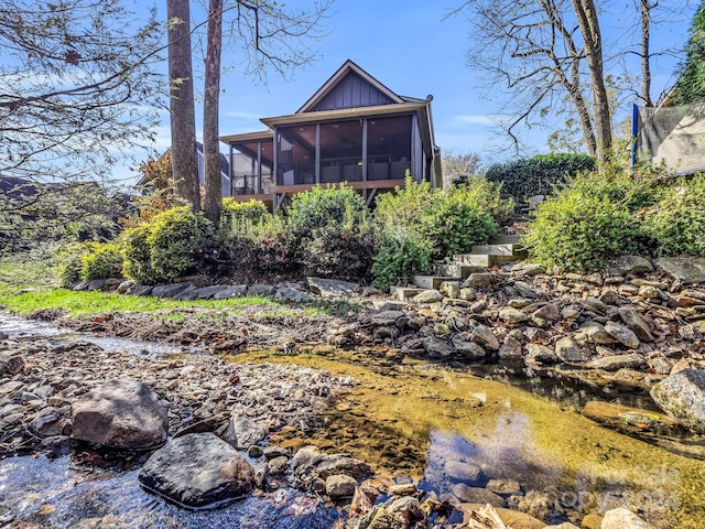 268 Firefly Cv, Lake Lure, NC 28746 - rear view of house with a sunroom