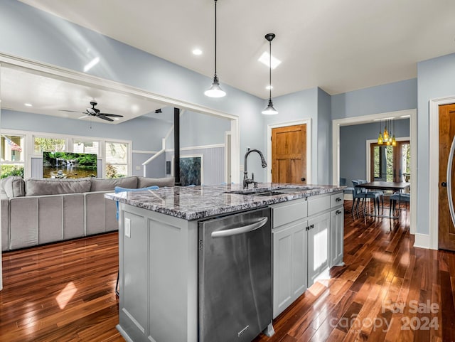 kitchen featuring sink, stainless steel dishwasher, an island with sink, dark hardwood / wood-style flooring, and white cabinetry