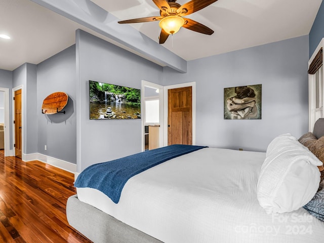 bedroom with ceiling fan and dark hardwood / wood-style flooring