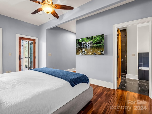 bedroom featuring access to outside, dark hardwood / wood-style flooring, ensuite bathroom, and ceiling fan