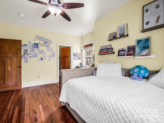 bedroom featuring dark hardwood / wood-style floors and ceiling fan