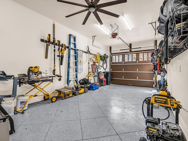 garage with a garage door opener and ceiling fan