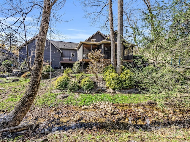 268 Firefly Cv, Lake Lure, NC 28746 - back of property featuring a sunroom and board and batten siding