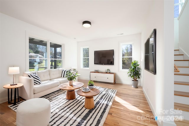 living room with light hardwood / wood-style flooring