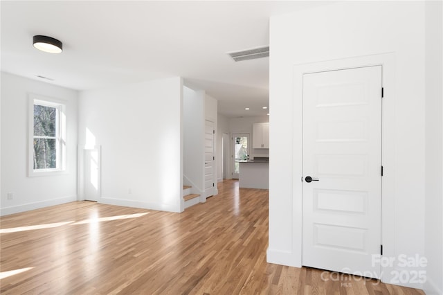 spare room with light wood-type flooring