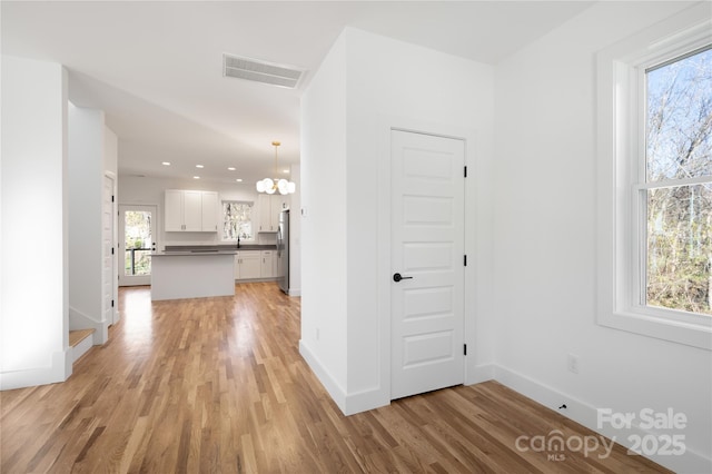 hallway featuring light hardwood / wood-style floors