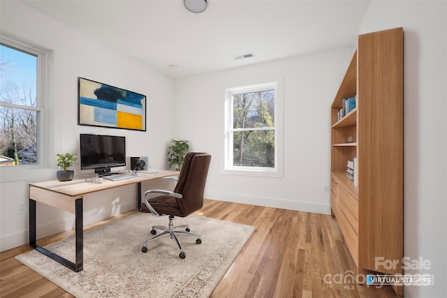 office area with light hardwood / wood-style flooring