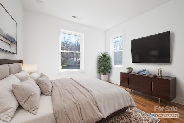 bedroom with light hardwood / wood-style flooring