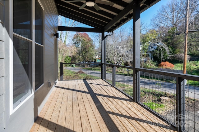 wooden terrace featuring ceiling fan