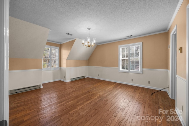 bonus room featuring a chandelier, vaulted ceiling, wood-type flooring, and a baseboard radiator