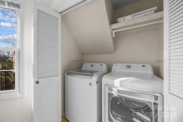 clothes washing area with independent washer and dryer