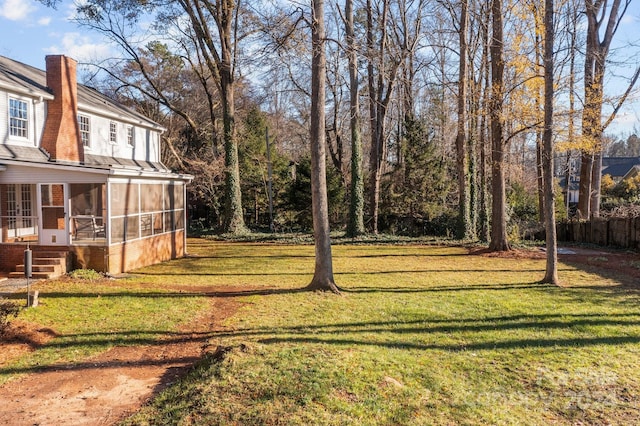 view of yard with a sunroom