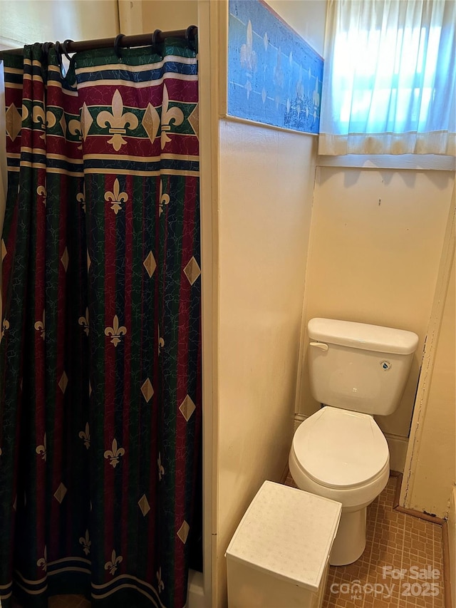 bathroom featuring toilet