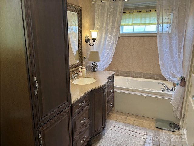 bathroom featuring vanity and a tub to relax in