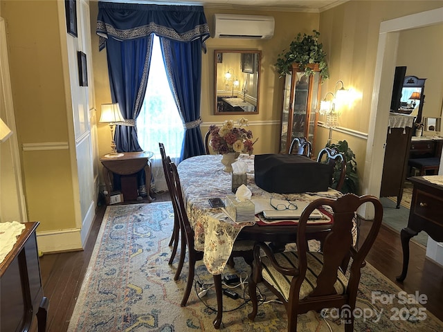 dining area featuring hardwood / wood-style flooring, ornamental molding, and a wall mounted AC