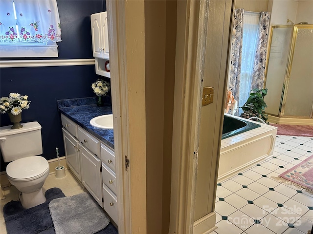 full bathroom with independent shower and bath, vanity, and toilet