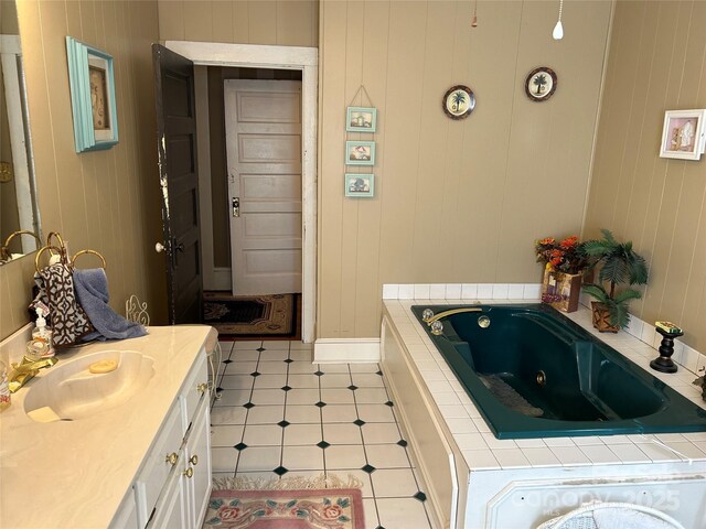 bathroom with vanity and a bath