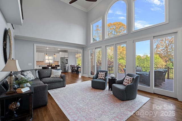 sunroom featuring ceiling fan