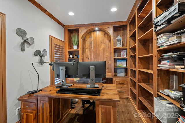 office space with dark wood-type flooring and ornamental molding