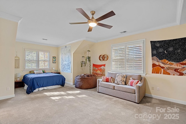 carpeted bedroom with multiple windows, ceiling fan, and ornamental molding