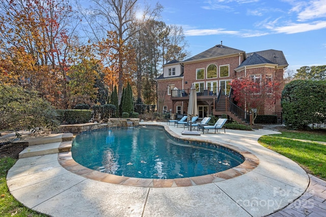 view of swimming pool featuring a patio area