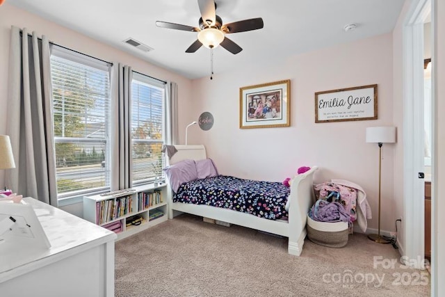 bedroom featuring ceiling fan and light carpet