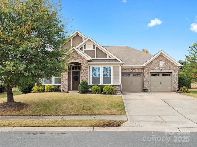 craftsman house with a front yard and a garage